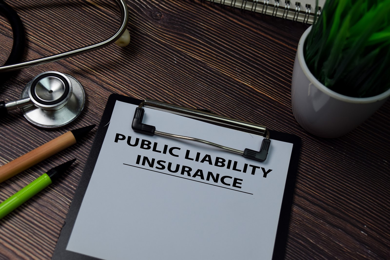 clip board with public liability wording on it